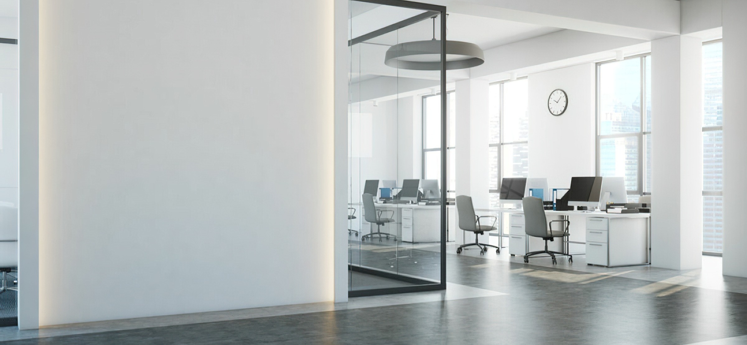 Bright modern office with glass walls and desks