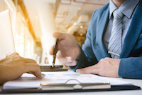 Advisor reviewing documents with a client