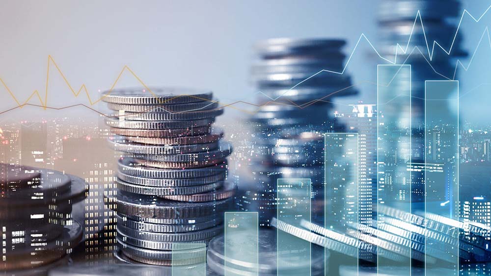 Stacks of coins over a city skyline with a rising performance graph