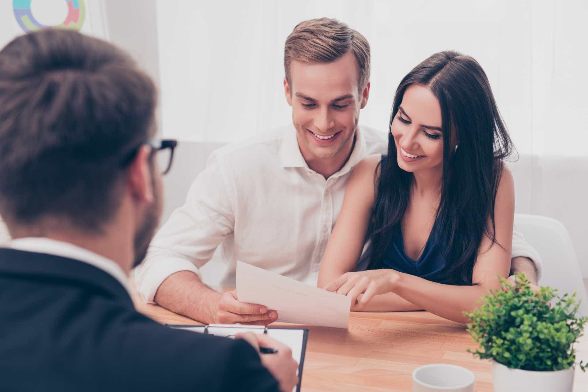 Advisor reviewing a retirement plan with a young couple