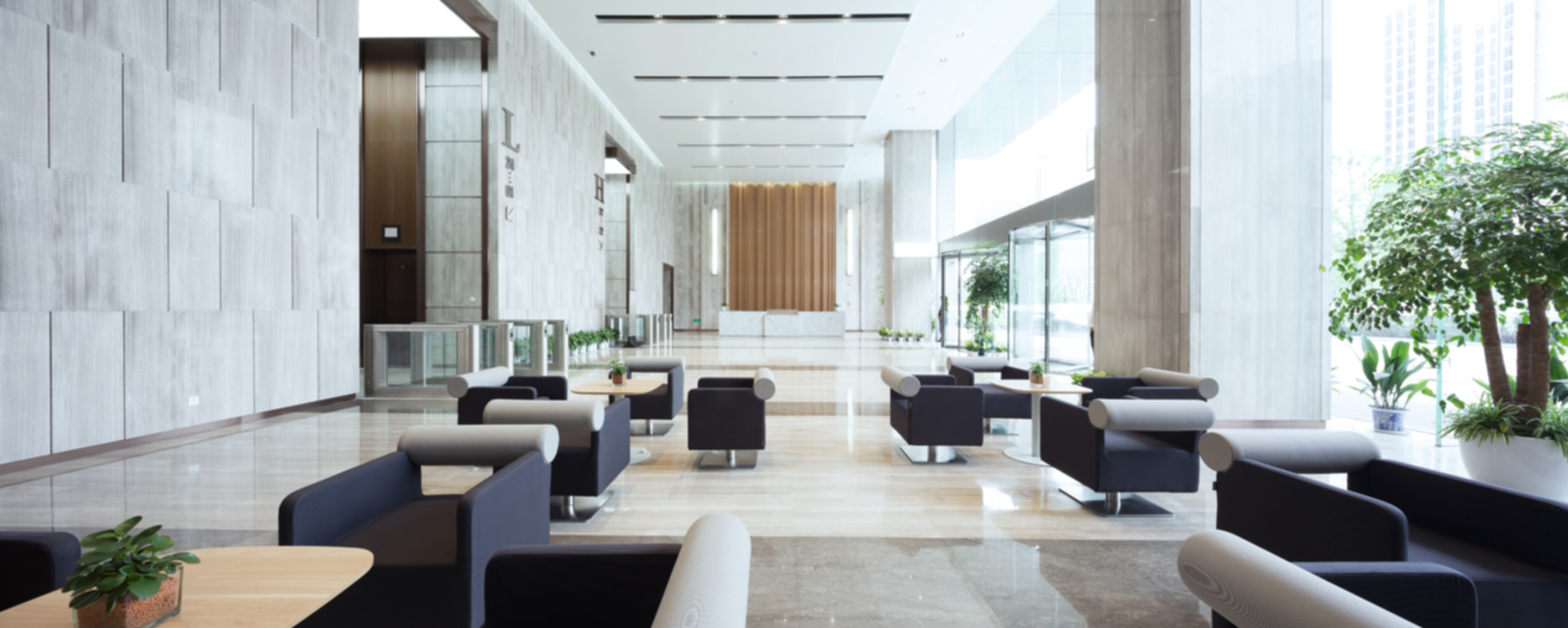 Bright modern office lobby with lounge seating
